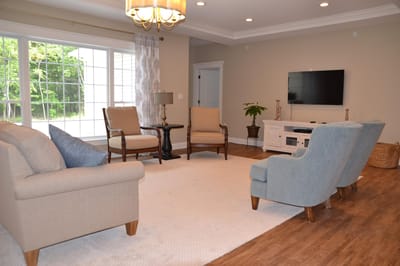 Bright common area with seating and a television