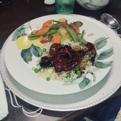 A plate of food with vegetables and rice.