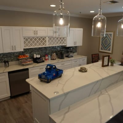 Modern kitchen with decorative elements and turquoise accents.
