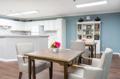 Interior view of a common area with tables and chairs