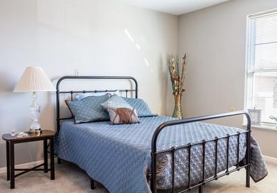 Cozy bedroom setup with decorative elements.
