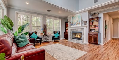 Cozy interior common area with seating and fireplace.