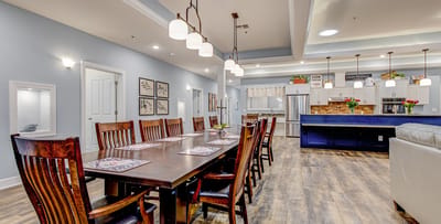 Modern dining room with a long table and seating