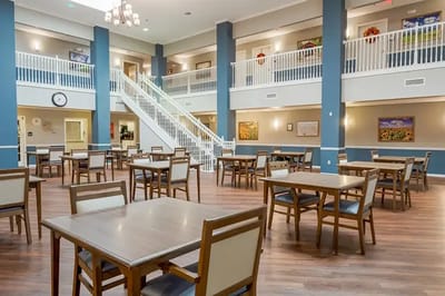 Bright common area with dining tables and decor