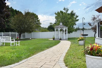 Pathway leading to a gazebo in a garden