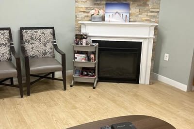 Cozy common area with seating and fireplace.