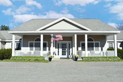 Front exterior view of the facility with American flag