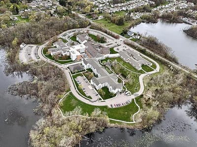 Aerial view of The Orchards facility surrounded by greenery