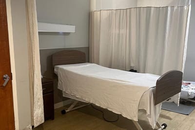 Empty resident room with a hospital bed