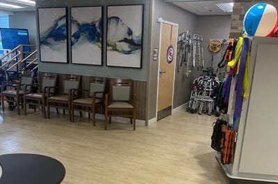 Common area with seating and art on the walls.