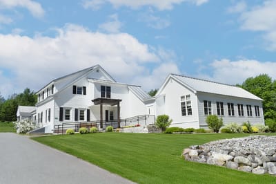 Exterior view of the facility with landscaped grounds.