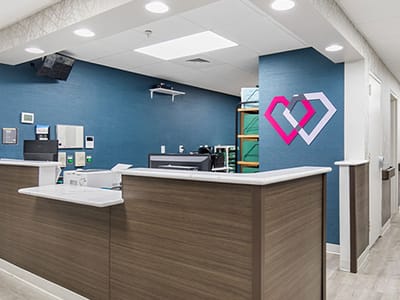 Reception area with modern decor and blue wall
