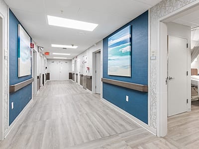 Bright hallway with paintings and modern decor