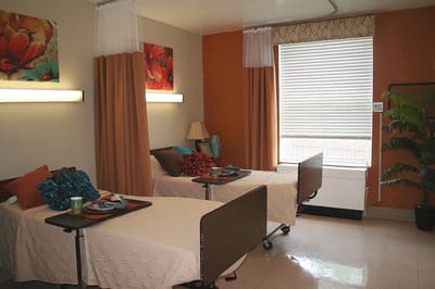 Bright and inviting resident room with two beds