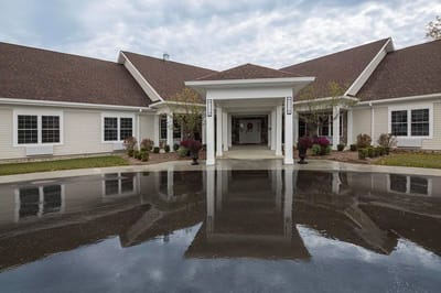 Front entrance of the facility with landscaped area.