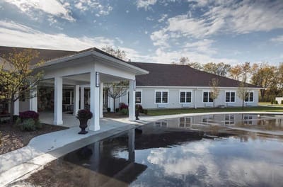 Exterior view of the facility with landscaping.