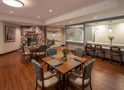 Dining area with tables and a fireplace