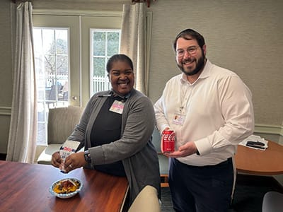 Staff members enjoy snacks and drinks together.