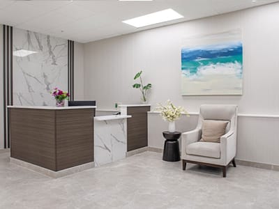 Modern reception area with plants and artwork