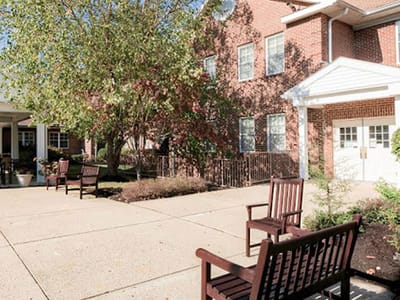 Outdoor seating area with benches and landscaping