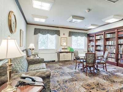 Cozy common area with bookshelves and seating