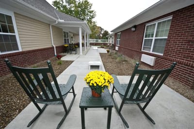 Outdoor seating area with potted flowers