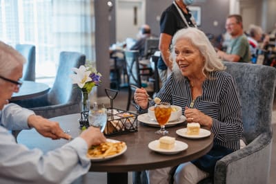 Residents enjoying a meal in the dining area.