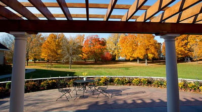 Outdoor patio with colorful autumn trees
