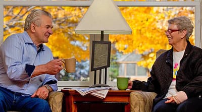 The Estates at Twin Rivers, Nursing Home in Anoka, MN — Seniors enjoying conversation with coffee in a cozy setting
