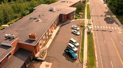Aerial view of the facility with parking area
