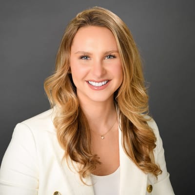 Professional headshot of a smiling woman