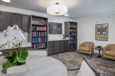 Comfortable common area with bookshelves and seating