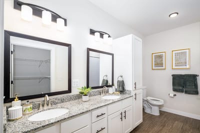 Bright and modern bathroom with dual sinks.
