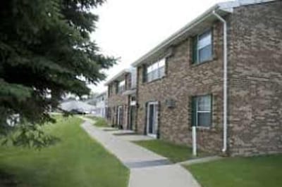 Exterior view of residential buildings with walkways.