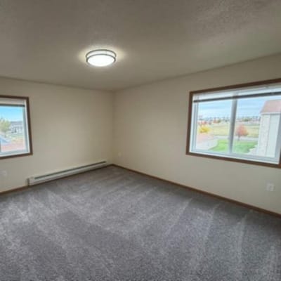 Cozy private resident room with windows.