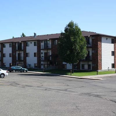 Exterior view of a residential building with landscaping.
