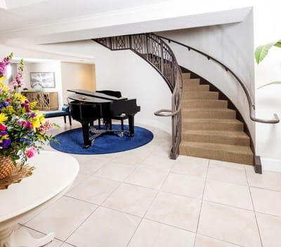 Interior view of a common area with a piano