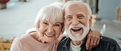 Smiling elderly couple enjoying time together outdoors