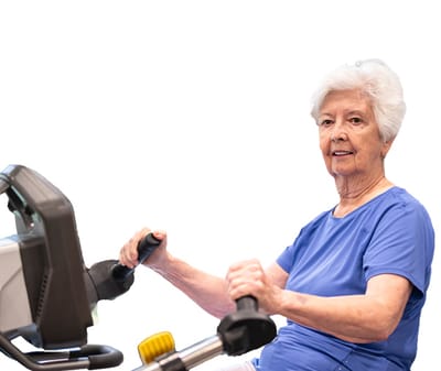Senior woman exercising on a stationary bike