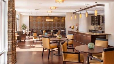 Bright dining area with tables and chairs