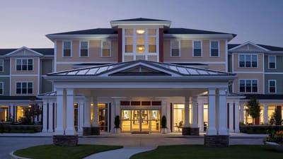Exterior view of Wingate Residences at Needham at dusk