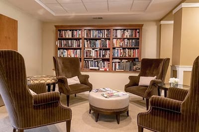 Cozy common area with bookshelves and seating