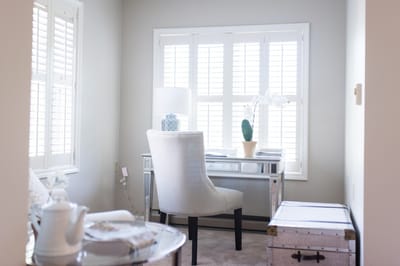 A bright interior space with a desk and chair