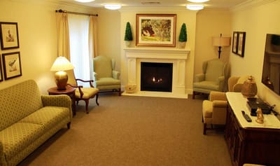 Cozy common area with seating and a fireplace