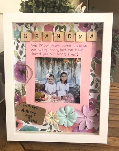A framed photo of two children with decorations