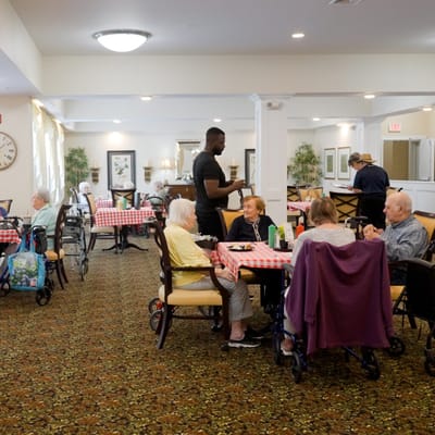 Residents enjoying a meal in the dining area.