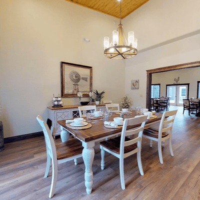 Dining area with a large wooden table and chairs