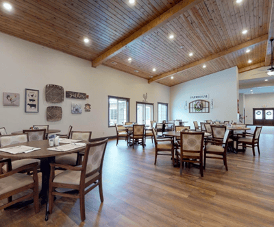 Dining area with wooden accents and chairs.
