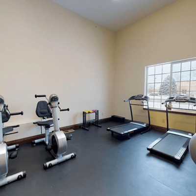 Interior view of a fitness area with machines.