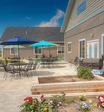 Outdoor patio area with tables and umbrellas